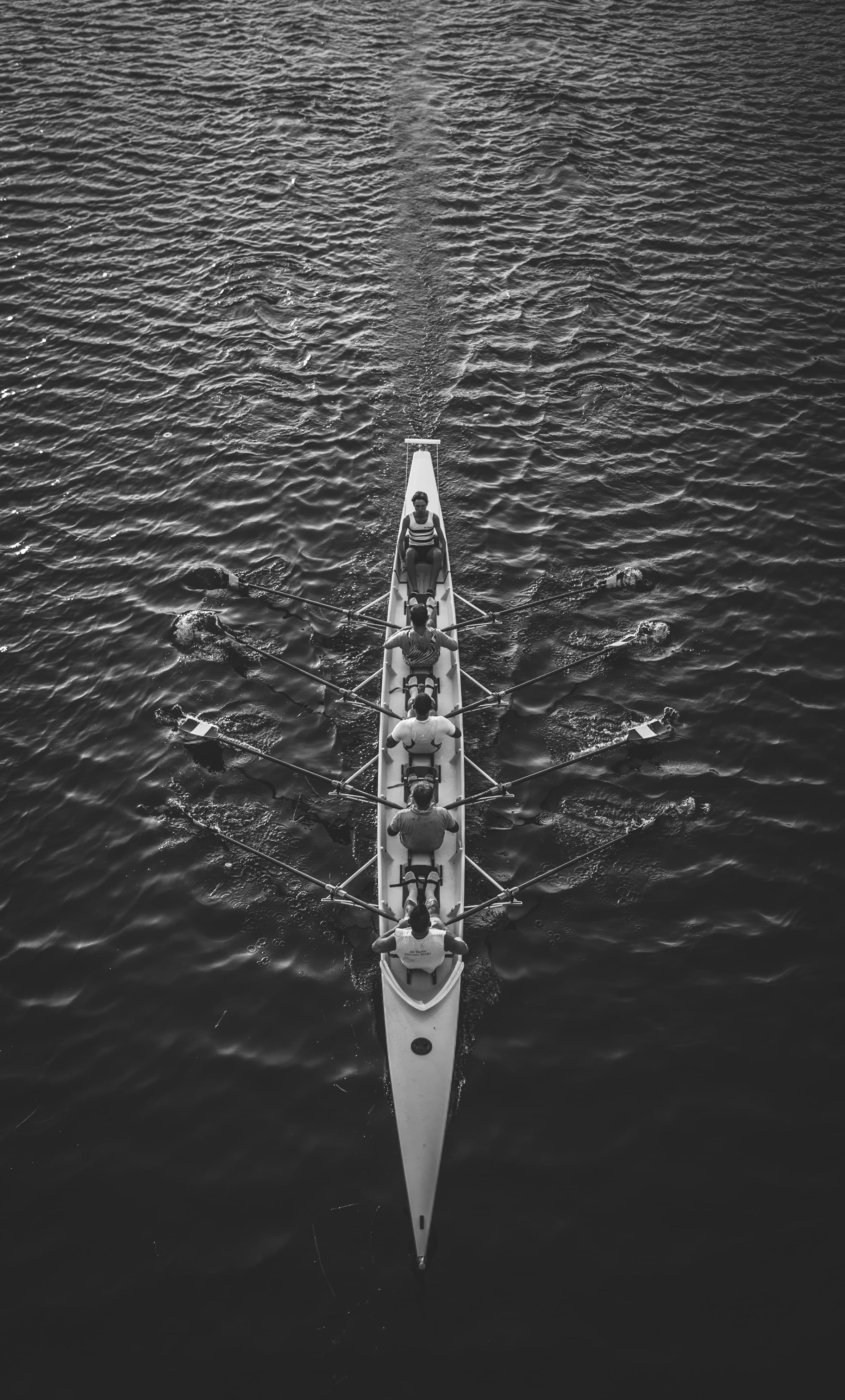 A group of people rowing a boat